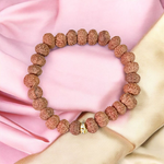 7 Mukhi Rudraksha Bracelet with 9mm beads, hand-strung on stretchable thread and lab certified for authenticity and energy benefits