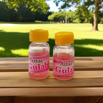 A 4ML roll-on bottle of Gulab Attar by Veena, displayed with rose petals around it, symbolizing purity, romance, and timeless floral elegance