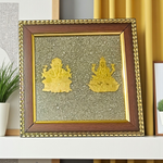 A 7x7 inch wooden frame with a divine image of Lakshmi and Ganesha, embedded with raw Pyrite stone, ideal for wealth, success, and Vastu correction