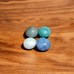 A colorful set of 8 milky round glass pebbles in multicolor, arranged on a white background – ideal for decoration, aquariums, and vases