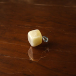 A handcrafted Yellow Aventurine stone pendant with a polished oval gemstone set in a sleek metal frame, suitable for men and women