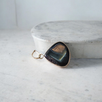 A lab-certified Natural Sulemani Pendant with a polished black agate stone set in sterling silver, displayed on a clean white background