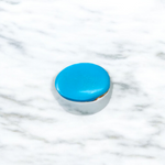 Close-up image of an Original Turquoise (Firoza) Stone with smooth polish and natural color patterns, ideal for healing and confidence