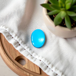Close-up image of an Original Turquoise (Firoza) Stone with smooth polish and natural color patterns, ideal for healing and confidence