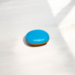 Close-up image of an Original Turquoise (Firoza) Stone with smooth polish and natural color patterns, ideal for healing and confidence