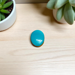 Close-up image of an Original Turquoise (Firoza) Stone with smooth polish and natural color patterns, ideal for healing and confidence