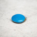 Close-up image of an Original Turquoise (Firoza) Stone with smooth polish and natural color patterns, ideal for healing and confidence