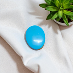 Close-up image of an Original Turquoise (Firoza) Stone with smooth polish and natural color patterns, ideal for healing and confidence