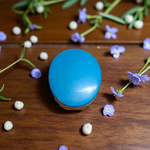 Close-up image of an Original Turquoise (Firoza) Stone with smooth polish and natural color patterns, ideal for healing and confidence