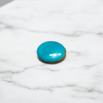 Close-up image of an Original Turquoise (Firoza) Stone with smooth polish and natural color patterns, ideal for healing and confidence