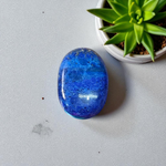 Close-up image of polished Lapis Lazuli stone by MALAWALA showing deep blue color and natural gold flecks
