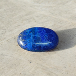 Close-up image of polished Lapis Lazuli stone by MALAWALA showing deep blue color and natural gold flecks