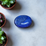 Close-up image of polished Lapis Lazuli stone by MALAWALA showing deep blue color and natural gold flecks