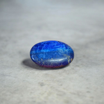 Close-up image of polished Lapis Lazuli stone by MALAWALA showing deep blue color and natural gold flecks