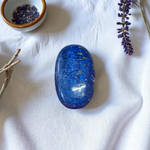 Close-up image of polished Lapis Lazuli stone by MALAWALA showing deep blue color and natural gold flecks
