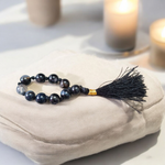 Close-up of MALAWALA Natural Black Sulemani Finger Mala with 9+1 polished 8mm beads, ideal for meditation, chanting, and daily wear
