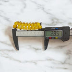 Close-up of Yellow Hakik Agate Bracelet with 8MM polished natural beads arranged in a circular pattern on a neutral background