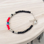 Evil Eye Anklet for Kids featuring black and red beads with stretchable design, ideal for daily wear and spiritual protection