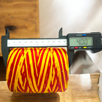 Extra large bundle of red Kalawa Moli thread, neatly rolled, with strands displayed beside for ceremonial use