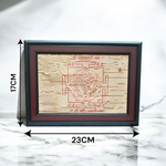 Hand-inscribed Mahakali Yantra on Bhojpatra with red ink, enclosed in a wooden frame, ideal for spiritual protection and tantric worship