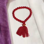 Handcrafted Red Hakik Mala made with natural Red Agate beads in 27+1 and 108+1 variants, placed on a wooden surface with lab certificate