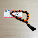 Handcrafted Rudraksha and Black Hakik mala with 5 Mukhi Rudraksha beads, used for protection, grounding, and meditation, available in 27+1 and 108+1 variants