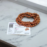 Image of 4 Mukhi Rudraksha Mala from Malawala, showcasing natural beads in 27+1 and 108+1 variants with certification