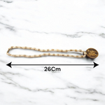 Image of Hanuman Ji Locket strung in Tulsi Mala with natural wood beads, placed on a white background