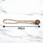 Image of Hanuman Ji Locket strung in Tulsi Mala with natural wood beads, placed on a white background