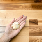 Image showing a set of two large Gomati Chakras with natural spiral patterns, placed on a white cloth, ideal for Puja and decoration