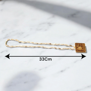 Jai Shri Bageshwar Dham Tulsi Mala with metal locket and screw-lock clasp, displayed against a plain white background