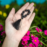 Natural Lava Finger Mala with 9+1 black porous lava beads, handcrafted for meditation and healing, displayed on a white background