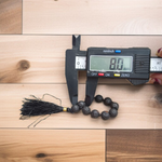 Natural Lava Finger Mala with 9+1 black porous lava beads, handcrafted for meditation and healing, displayed on a white background
