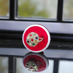 Oval-shaped gold-plated Navratan ring with nine colorful gemstones set in a tortoise design for spiritual and astrological benefits