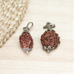 Pendant featuring lab certified 3 Mukhi and 4 Mukhi Rudraksha beads in a dual-metal cap design, placed against a neutral background
