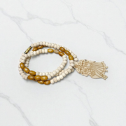 Radha Krishna Tulsi Chandan Mala featuring alternating Tulsi and sandalwood beads, engraved pendant, and screw-lock clasp, displayed neatly