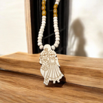 Radha Krishna Tulsi Chandan Mala featuring alternating Tulsi and sandalwood beads, engraved pendant, and screw-lock clasp, displayed neatly