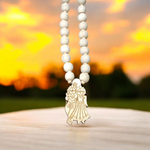 Radha Krishna Tulsi Mala with engraved pendant and screw lock, neatly arranged for devotional use on a soft background