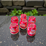 Red chandan paste container used for tilak, puja, and religious ceremonies