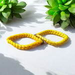 Set of 2 Handmade Yellow Raksha Sutra Bracelets with adjustable cotton thread, designed for spiritual protection and daily wear