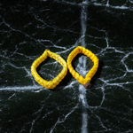 Set of 2 Handmade Yellow Raksha Sutra Bracelets with adjustable cotton thread, designed for spiritual protection and daily wear