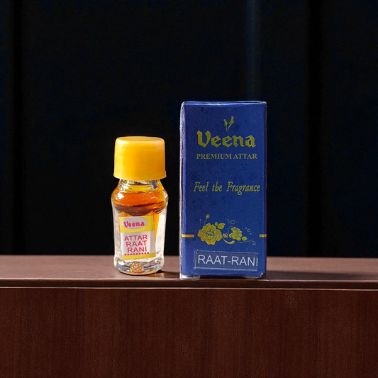 1ML bottle of Raat Rani Attar with applicator placed beside night-blooming jasmine flowers and diya lamp on a wooden altar