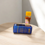 1ML bottle of Raat Rani Attar with applicator placed beside night-blooming jasmine flowers and diya lamp on a wooden altar