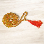 A 108+1 bead Citrine mala made from 8mm natural citrine crystals, used for meditation, japa, and spiritual practices