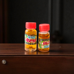 A 4ML roll-on bottle of Bela Attar by Veena, placed with jasmine (Bela) flowers on a wooden surface, symbolizing purity, peace, and tradition