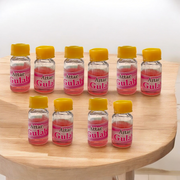 A 4ML roll-on bottle of Gulab Attar by Veena, displayed with rose petals around it, symbolizing purity, romance, and timeless floral elegance