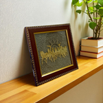A 7x7 inch wooden Vastu frame featuring seven golden horses running toward the rising sun with a centrally placed Pyrite stone, ideal for wealth and energy correction