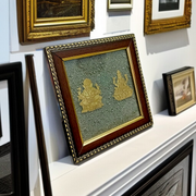 A 7x7 inch wooden frame with a divine image of Lakshmi and Ganesha, embedded with raw Pyrite stone, ideal for wealth, success, and Vastu correction