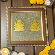 A 7x7 inch wooden frame with a divine image of Lakshmi and Ganesha, embedded with raw Pyrite stone, ideal for wealth, success, and Vastu correction