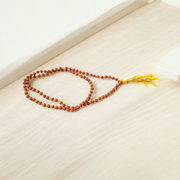 A Lab Certified 5 Mukhi Rudraksha Mala featuring 108+1 small 4mm natural Rudraksha beads, hand-knotted for japa and meditation